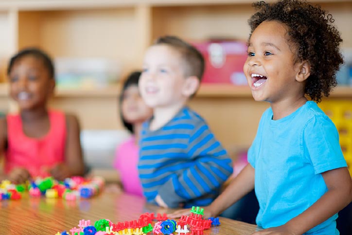 A diverse group of preschoolers in a classroom